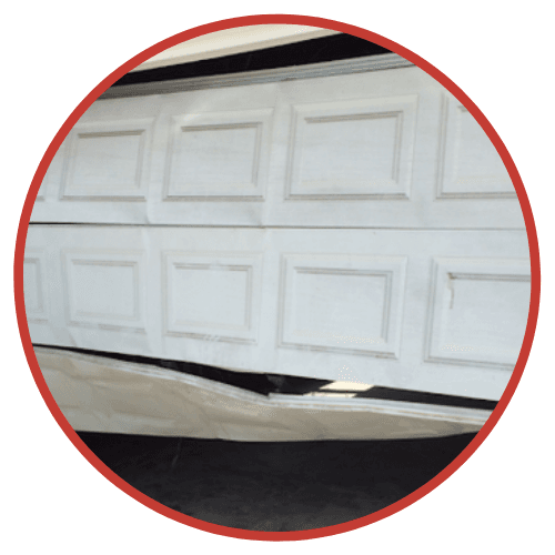 Damaged Commercial Garage Doors - Repairs Done by The Door Master