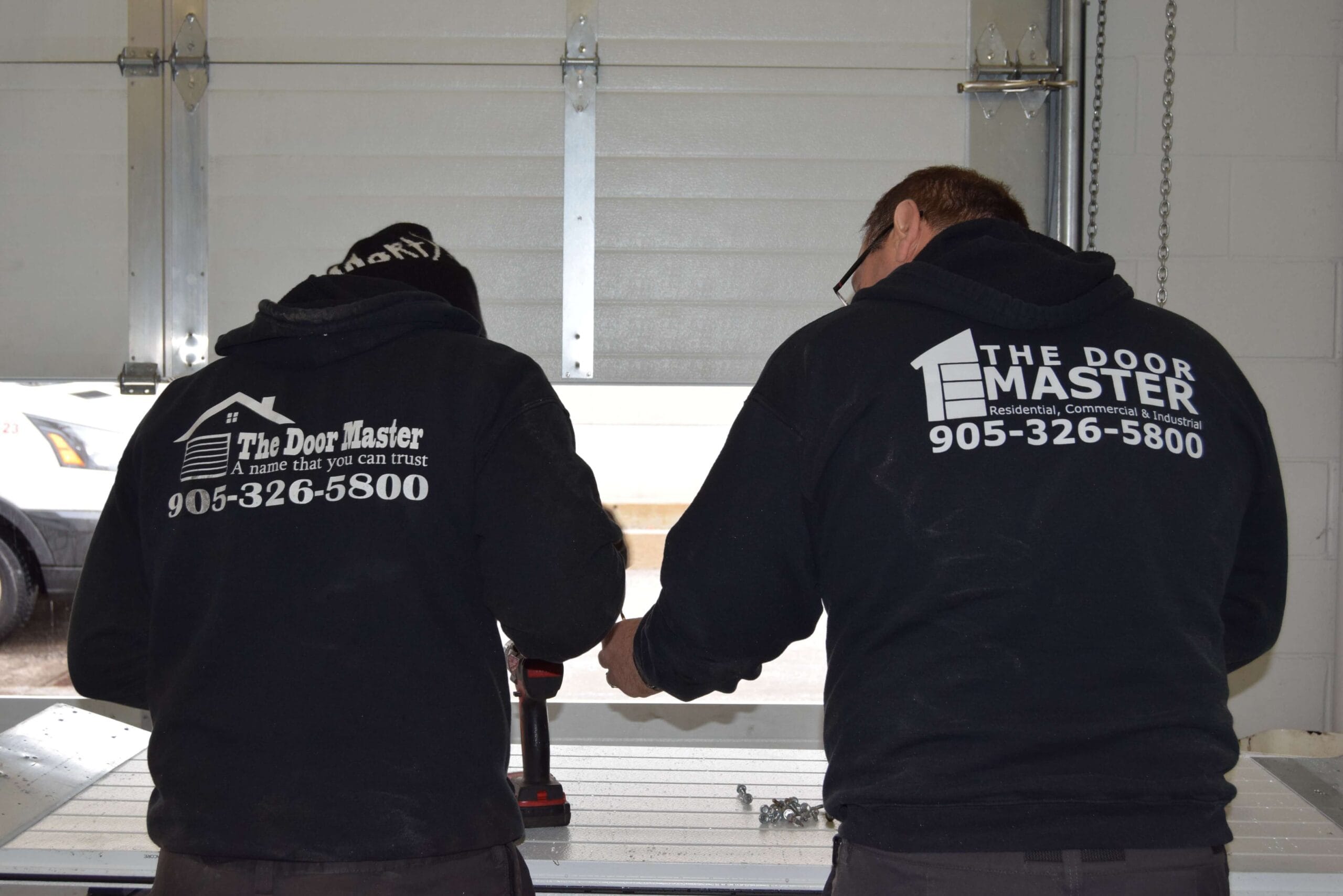 The Door Master's Team at Work, Installation of Garage Doors.